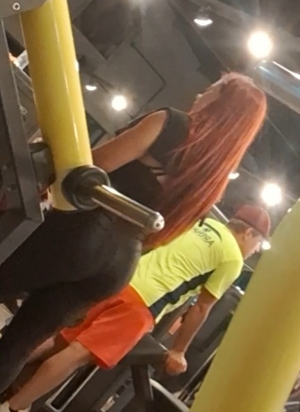 ass big_ass black_clothing from_behind gym milf real_person red_hair